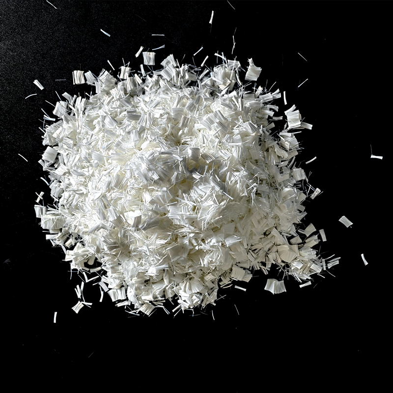 Fibra de poliéster de baixo encolhimento no fabrico de papel